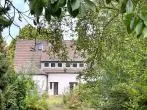 Gartenansicht - Sanierungsbedürftige Doppelhaushälfte auf großem Grundstück in Dortmund-Brackel
