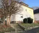 Außenansicht - 3 vermietete Wohnungen! – Renovierungsbedürftige Kapitalanlage in ruhiger Waldrandlage in Gevelsberg